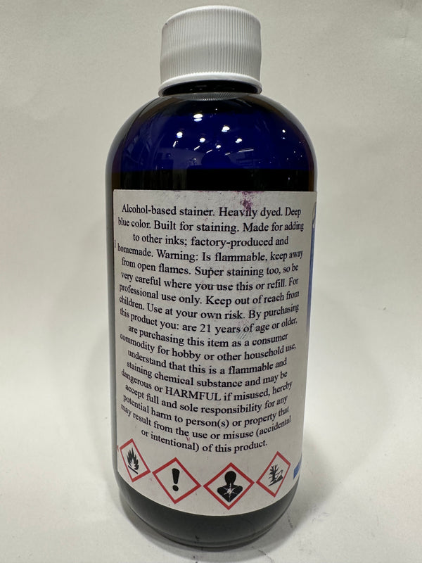 Glass bottle of CG Liquid Ink Refill in the color Ghoulish Garvey Blue