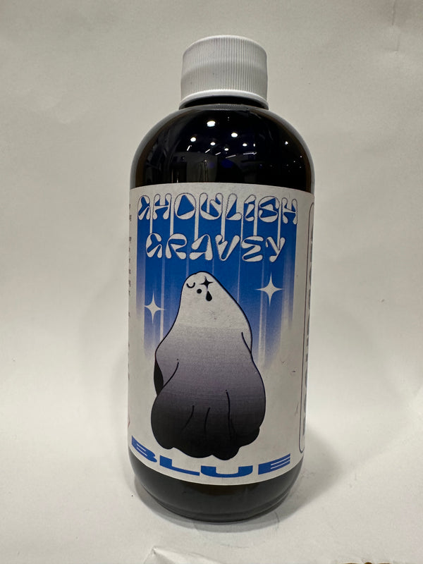 Glass bottle of CG Liquid Ink Refill in the color Ghoulish Garvey Blue