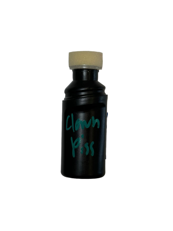 Black plastic bottle with no yellow cap of CG Liquid in the color Clown piss