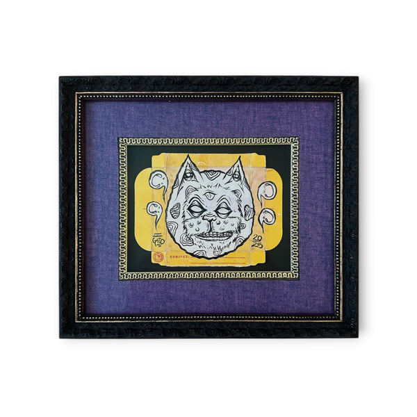 Original black framed mixed media Eye Gato artwork painted on vintage film packaging, featuring the pyramid eye design in yellow, black, and white.