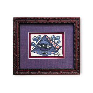 Eye Gato pyramid blue eye painted on rives paper, mounted on red background, purple matted, and red floral texture custom wood frame.