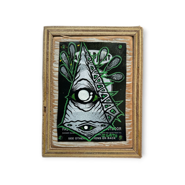 Upcycled silver pyramid with green outline painting on spray can material, remounted on reclaimed street sign wood.
