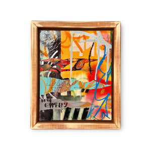 Mixed media of acrylic paints and markers in black, white, blue and orange tones in a floating wood frame.